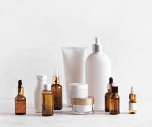 Assortment of travel-size skincare bottles and jars