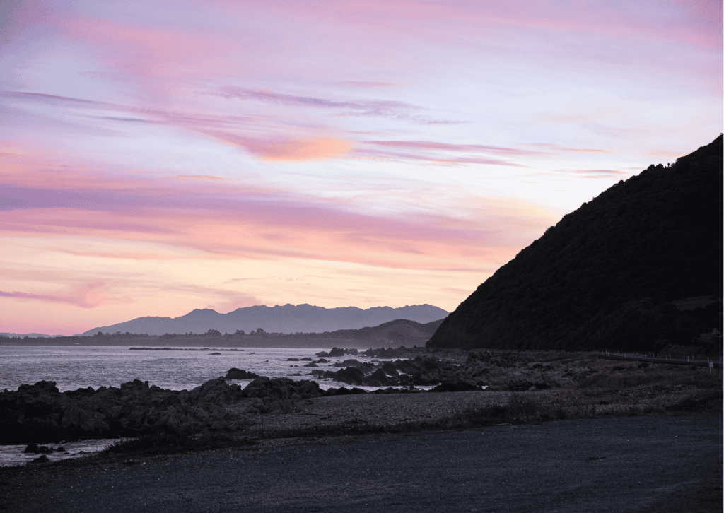 Sunset over the coast at the end of the road trip
