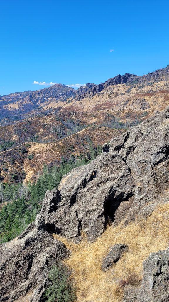 Rocky outcrops and steep chaparral slopes on the climb up Bald Hill