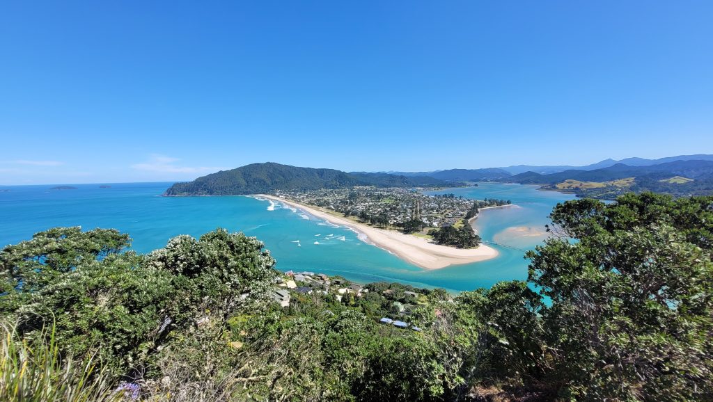 View from the Pauanui Summit Loop track over the sand spit, estuary and turquoise sea at Pauanui