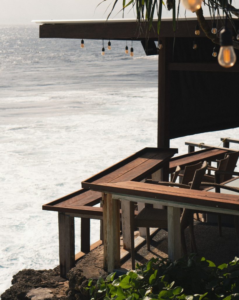 Cliffside cafe overlooking crashing waves, a popular spot to watch surfers on Nusa Lembongan