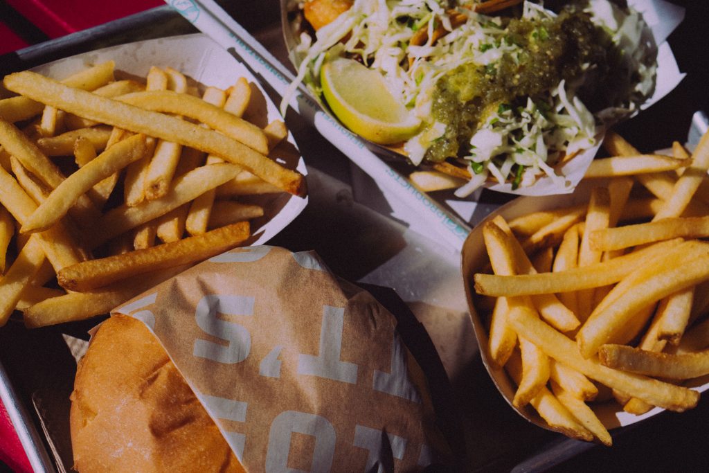 A burger and fries served in a basket at a restaurant in downtown Napa