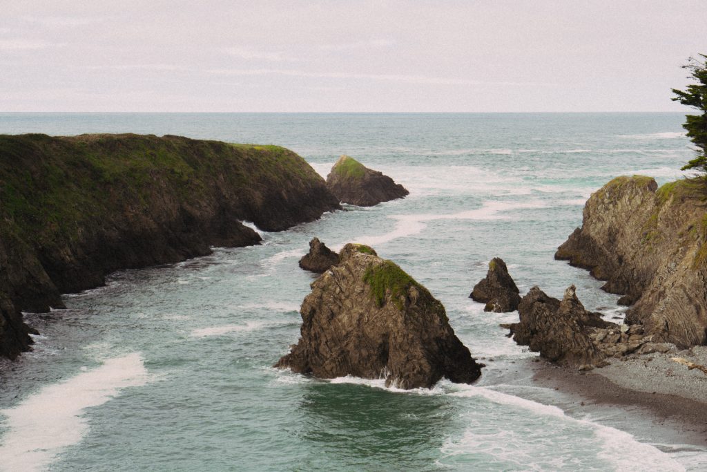 Sea stacks and a narrow cove carved into the cliffs at Mendocino Headlands