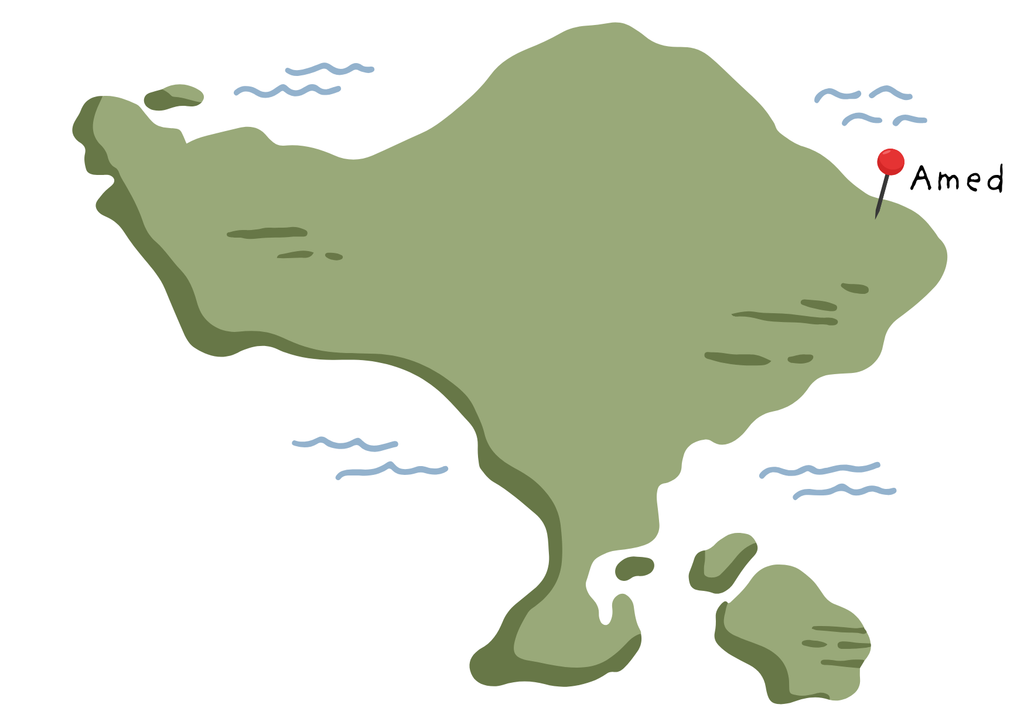 Illustrated map of Bali with a red pin marking Amed on the northeast coast