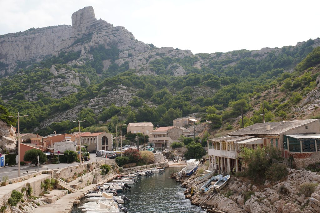 Fishermen's cabanons and small boats in the tiny harbour of Callelongue at the eastern edge of Marseille